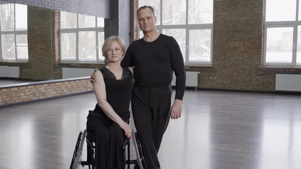 Professional Ballroom Dancers Posing in Dance Hall alt