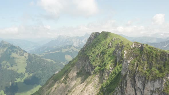 Beautiful aerial of green mountain summit in Switzerland alt