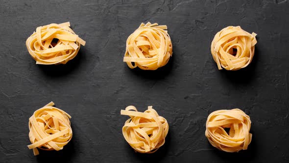 Fresh italian pasta on black background