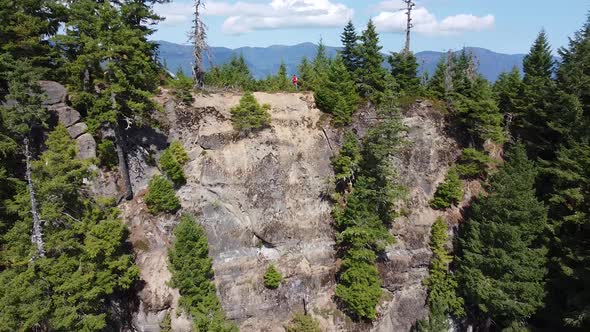 Hiker Standing on Cliff Summit of Thunder Mountain, Vancouver Island, BC, Canada alt