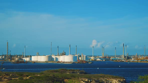 The peaceful oil refinery in Isla, Curacao - Wide pan shot alt