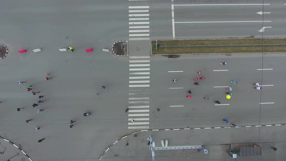 Aerial Top Down Shot of Many Athletic People at Running Marathon on City Road alt