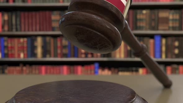 Flag of Latvia on Falling Judges Gavel in Court alt