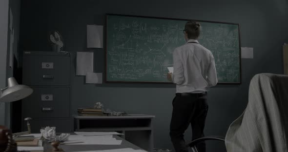 Creative mathematician working in his office