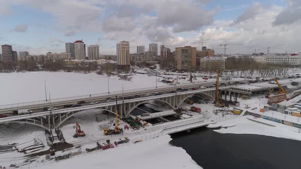 Aerial view of reconstruction of bridge in winter city 09 alt