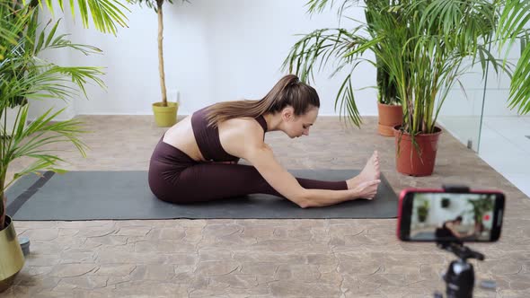Young Woman Going Yoga Exercise at Home