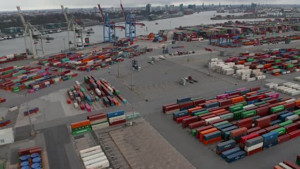 Forklifts Driving Around Cargo Container Terminal in Hamburg Port alt