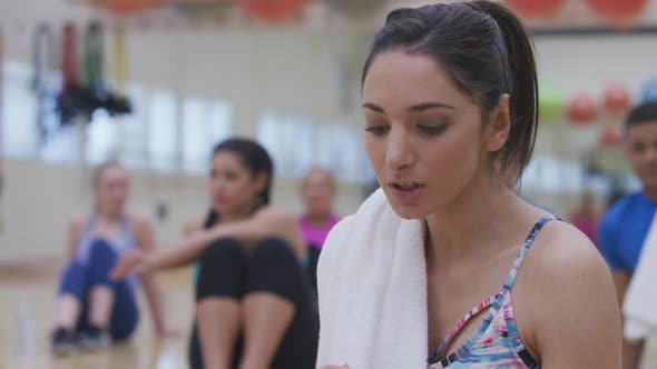 Woman at gym takes a break