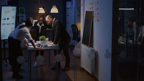 Diverse Multi Ethnic Businesspeople Teamwork Lean on Conference Table Having Brainstorming Session alt