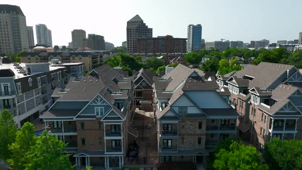 Rising aerial of housing and residential district in urban American city. alt