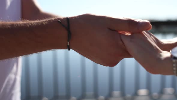 woman hand in a man hand close up alt