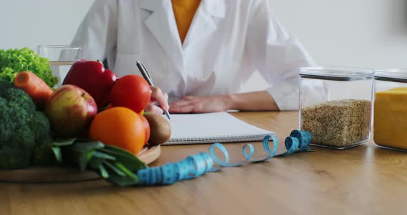 Nutritionist Giving Consultation to Patient with Healthy Fruit and Vegetable Right Nutrition and alt