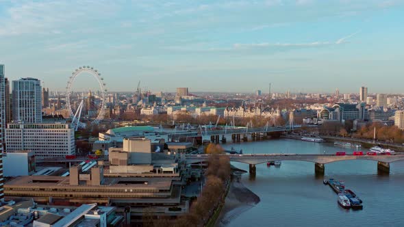 Establishing Aerial drone slider shot of thames river London eye Westminster at sunrise alt