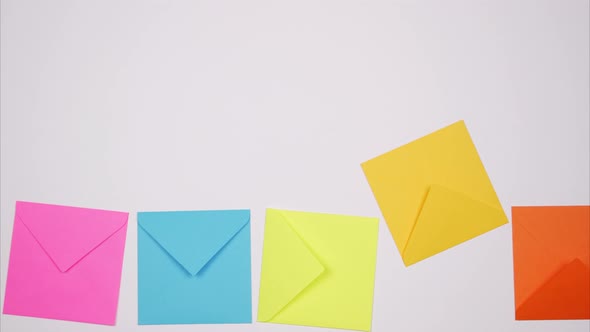 Multicolored Envelopes Fall From Top to Bottom. Stop Motion alt