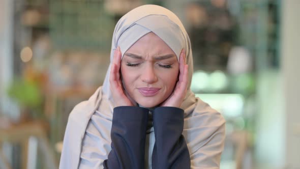 Portrait of Exhausted Young Arab Woman Having Headache alt