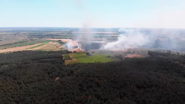 Aerial View of Fire in Wheat Field. Flying Over Smoke Above Agricultural Fields alt