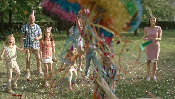Happy Boy Hitting Pinata alt