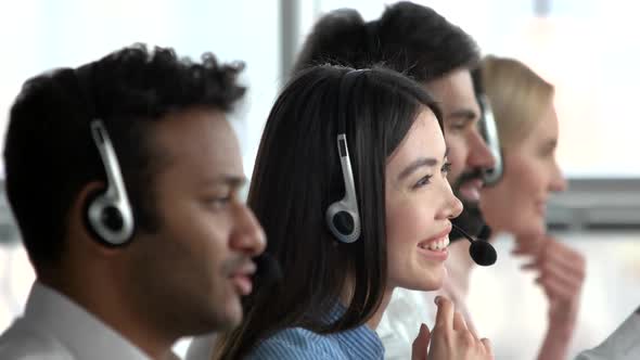 Asian Girl Working As Dispatcher in Office. alt
