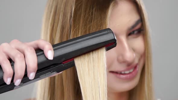 Closeup of Blonde Hair Straightening alt