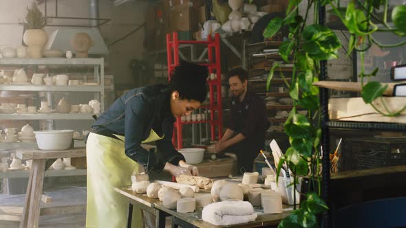 Man and Woman Are Working In Pottery Studio
