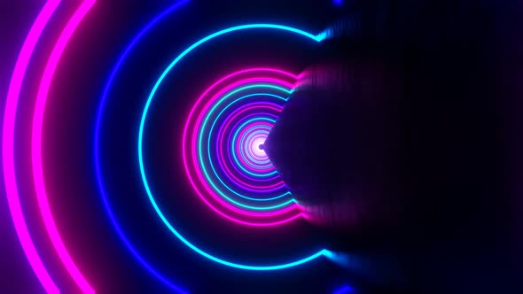 Looped Abstract Background of Flight Forward and Rotation in Neon Circles Tunnel