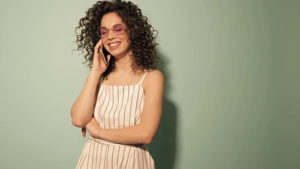 Beautiful smiling model with afro curls hairstyle dressed in hipster clothes alt