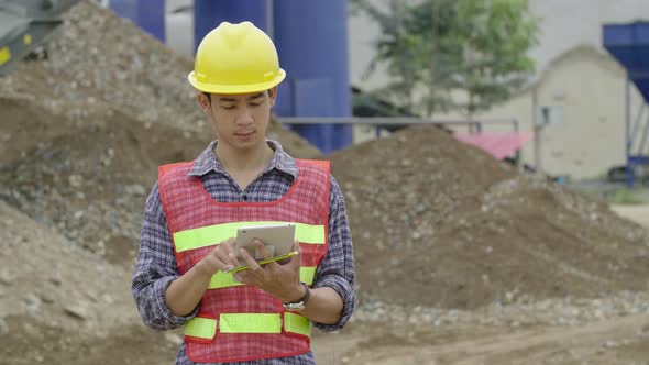 Construction Worker Using Tablet alt