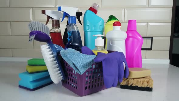 Different Products and Items for Cleaning on the Floor in the Kitchen