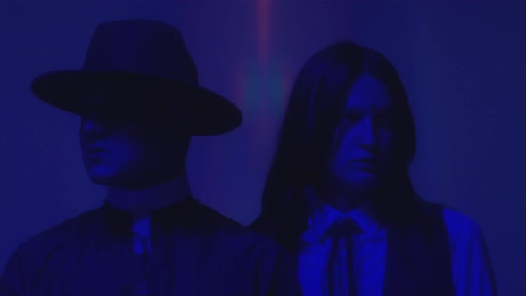 Schoolgirl and Priest in Neon Light alt