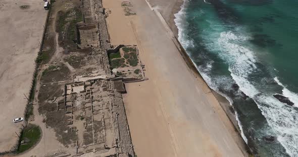 Aerial footage of the ancient remains of the coastal city of Caesarea, built under Herod the Great d alt