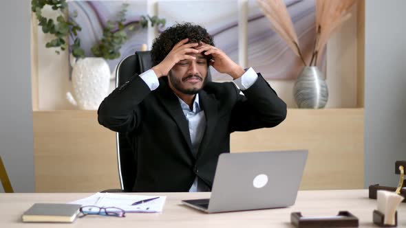 Irritated Arabian or Indian Businessman Ceo or Manager Sitting in a Modern Office Stressed alt