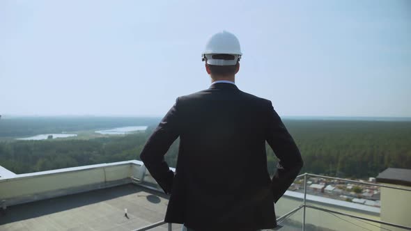 Male Architect in Helmet Standing Roof Looking Around, Construction Supervisor