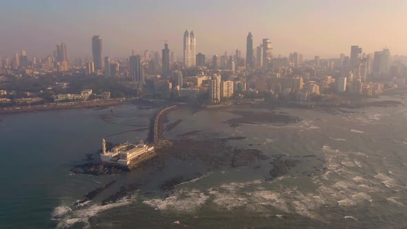 Mumbai, India, Haji Ali Dargah mosque 4k aerial drone footage sunset time alt