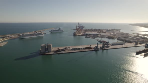 Cargo dock and commercial port in Malaga, Spain. Aerial circling
