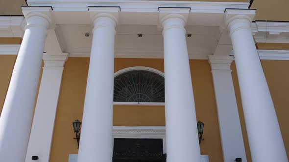 entrance to the catholic church with white columns alt