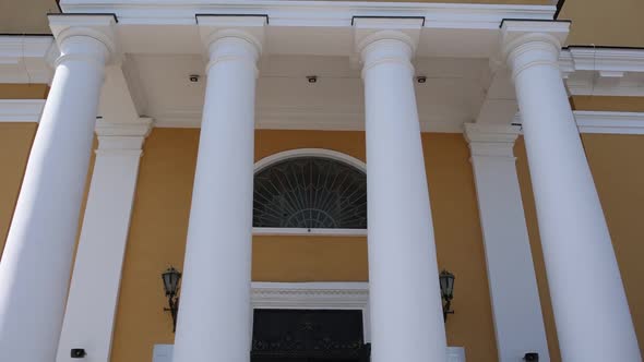 entrance to the catholic church with white columns