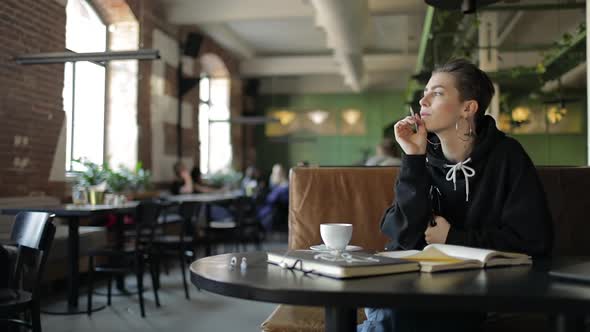 Thoughtful Girl Writing a Book alt