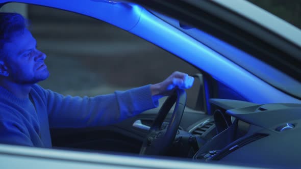 Man Sits in a Car Upset That He Was Stopped By the Police for a Traffic Violation alt