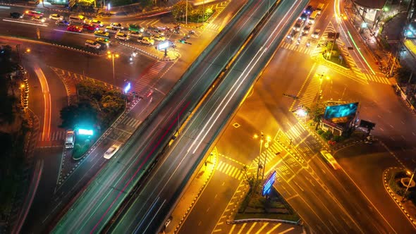 Time Lapse of Busy Highway Road Junction in Metropolis City Center at Night alt