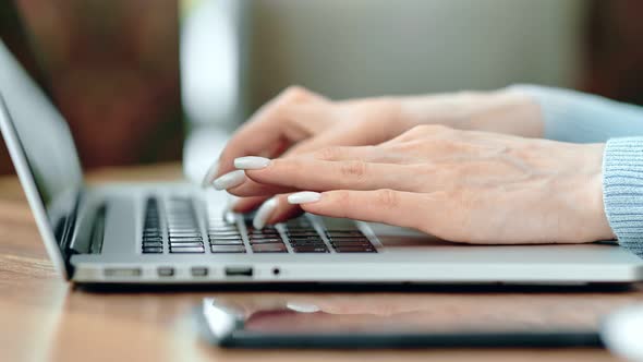 Female Hands Typing on Keyboard of Laptop Pc Working Side View alt
