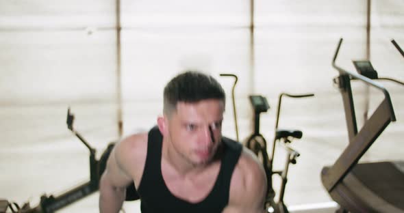 Training with Kettlebells, Intense Strength Exercise in Closed Gym. Men Doing Workout with alt