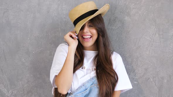 Young beautiful smiling woman looking at camera alt
