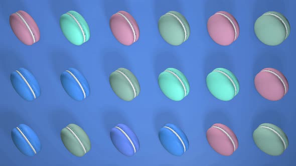 Multicolored macaron pastries on light Blue paper background