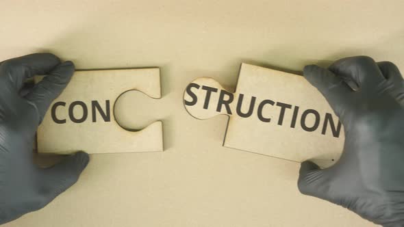 Completing Jigsaw Puzzle with CONSTRUCTION Text alt