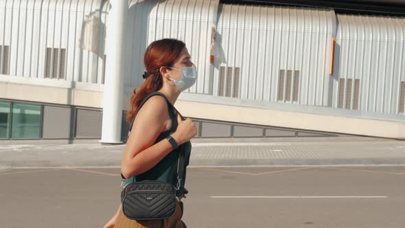 Young Stylish Woman Tourist Wearing Medical Protective Pollution Mask Face Standing Outdoor on a alt