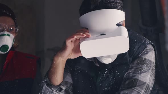 Artisans Discussing Data on Tablet in Workshop alt