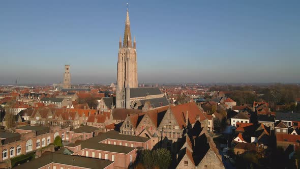 Approaching spire of Church of Our Lady Bruges and Belfry alt