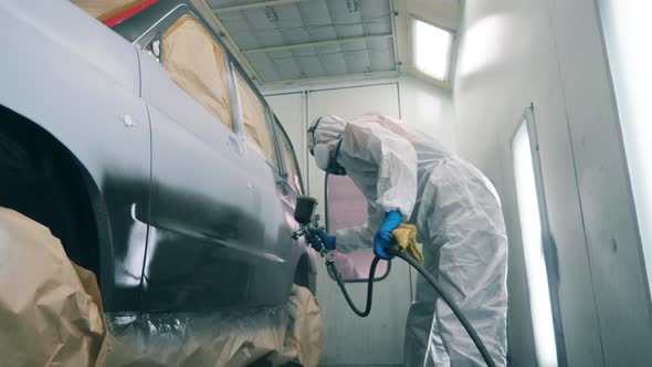 Mechanic Is Painting the Car in Slow Motion, Stock Footage | VideoHive