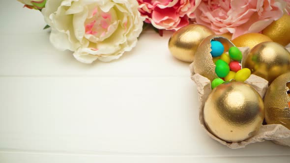 Golden Decorative Easter Eggs Filled with Colorful Candies on Wooden Table Close Up