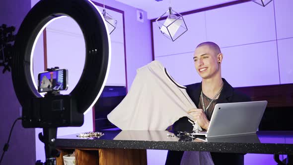 Caucasian Queer Lgbt Person Does Fashion Haul Shows Brand New White Tshirt to the Camera and Talks alt